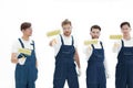 Team of builders with paint rollers Royalty Free Stock Photo
