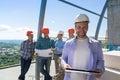 Team Of Builders On Site, Contractor Hold Plan Happy Smiling Over Apprentices Group Discussing Blueprint