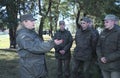 Team-building exercise: female officer instructing group of soldiers. Novo-Petrivtsi military base, Ukraine