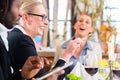 Team at business lunch meeting in restaurant Royalty Free Stock Photo