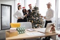 Team of business people celebrating new year in office with panoramic windows Royalty Free Stock Photo