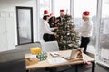 Team of business people celebrating new year in office with panoramic windows Royalty Free Stock Photo