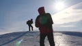 Team of business people climb to the top of their success. teamwork business people. three climber climb rope on snowy