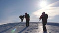 Team of business people climb to the top of their success. teamwork business people. three climber climb rope on snowy