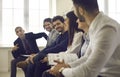 Team of business people having discussion during meeting or presentation in office Royalty Free Stock Photo