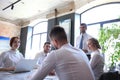 Team of business people having discussion at table in creative office Royalty Free Stock Photo