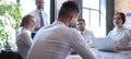 Team of business people having discussion at table in creative office Royalty Free Stock Photo