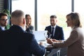 Team of business people having discussion at table in creative office Royalty Free Stock Photo