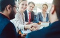 Team of business people negotiating an agreement closing the deal Royalty Free Stock Photo