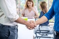 Team of business people negotiating an agreement closing the deal with handshake, Congratulations and Confirmation in the Royalty Free Stock Photo