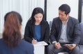 Team of business three people working together on a laptop with during a meeting Royalty Free Stock Photo