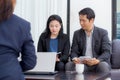 Team of business three people working together on a laptop. Royalty Free Stock Photo