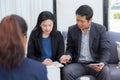 Team of business three people working together on a laptop with during a meeting Royalty Free Stock Photo