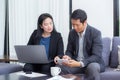 Team of business two people working together on a laptop with during a meeting Royalty Free Stock Photo