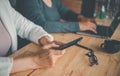 Team businessmans job. Working with smart phone and laptop in open space office. Meeting report in progress Royalty Free Stock Photo