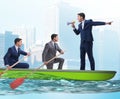 The team of businessmen in teamwork concept with boat Royalty Free Stock Photo