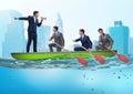 Team of businessmen in teamwork concept with boat Royalty Free Stock Photo