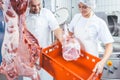 Team of butchers working with meat in butchery