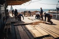 a team of carpenters and builders working on the deck of a ship