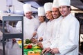 Team of chefs chopping vegetables Royalty Free Stock Photo