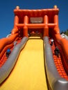 Team of children compete in speed climbing the inflatable slides