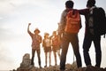 Team of climbers man and woman hiker hiking mountain climbing success stand at the cliff with backpacks on mountain top over . Royalty Free Stock Photo