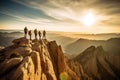 A team of climbers at the top of a high mountain in the light of the setting sun. Royalty Free Stock Photo