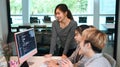 Team of coders brainstorming, working together for developing website design and coding technologies at creative office