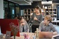 Team of coders planning, brainstorming ideas for new project at creative office