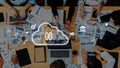 Team Collaboration in Business Office with Cloud Computing Technology and Data Analysis Charts on Table Displaying Royalty Free Stock Photo