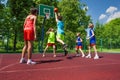 Team in colorful uniforms playing basketball game Royalty Free Stock Photo