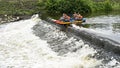 Team competitions on sports catamarans rafting on water, overcoming river rapids