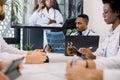 Team of confident multiethnic doctors having video conference meeting in modern hospital room. Group of professional Royalty Free Stock Photo