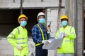 Team construction worker control in the house structure at construction site, during the spread of coronavirus Royalty Free Stock Photo