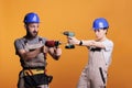 Team of construction workers holding drilling guns Royalty Free Stock Photo