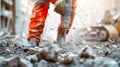 A team of construction workers in reflective vests and helmets working together to pour concrete for a foundation Royalty Free Stock Photo