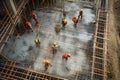 Team of the construction workers works on foundation of contemporary house. Royalty Free Stock Photo