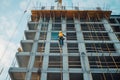 Team of the construction workers works on foundation of contemporary house. Royalty Free Stock Photo