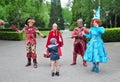 A team of costumed face characters greeting guest in Efteling amusement park