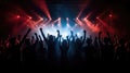 Team. A crowd of people in silhouette raises their hands on the dancefloor on neon light background. Night life, club, music, Royalty Free Stock Photo