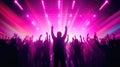 Team. A crowd of people in silhouette raises their hands on the dancefloor on neon light background. Night life, club, music, Royalty Free Stock Photo