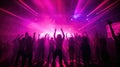 Team. A crowd of people in silhouette raises their hands on the dancefloor on neon light background. Night life, club, music, Royalty Free Stock Photo