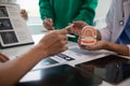 team of dentists is diagnosing inside conference room treating patient toothache. team of doctors and dentists are meeting to find Royalty Free Stock Photo