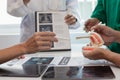 team of dentists is diagnosing inside conference room treating patient toothache. team of doctors and dentists are meeting to find Royalty Free Stock Photo