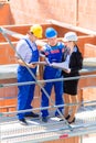 Team discussing construction or building site plans Royalty Free Stock Photo