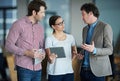 Team discussion, tablet or business people with ideas or research in group meeting talking together. Diversity Royalty Free Stock Photo