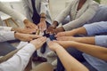 Team of diverse business people join hands to show concept of teamwork, unity and support Royalty Free Stock Photo