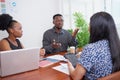 Team of diverse colleagues have heated discussion debate, boardroom table brainstorm Royalty Free Stock Photo