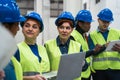 Team of diverse engineers working in robotic factory Royalty Free Stock Photo