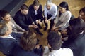 Team of diverse people having a meeting in the office, sitting in a circle and talking Royalty Free Stock Photo